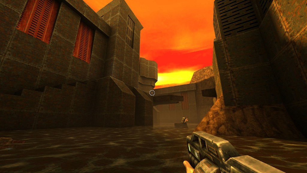 Quake 2: a sun setting behind some brutalist buildings.