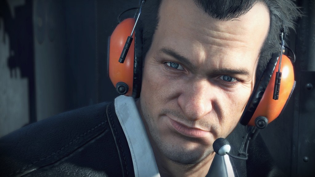 Dead Rising Deluxe Remaster: A close-up of Frank West wearing orange ear defenders.