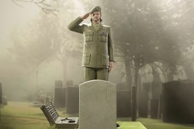 Metal Gear Solid 3 Snake Eater: Big Boss stands and salutes a grave and headstone.